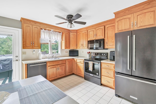 175 Cross Hill Rd, Monroe, CT 06468 - kitchen featuring appliances with stainless steel finishes, a sink, light countertops, a ceiling fan, and light tile patterned flooring