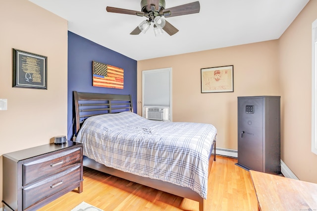175 Cross Hill Rd, Monroe, CT 06468 - bedroom with wood finished floors, a baseboard heating unit, cooling unit, and ceiling fan