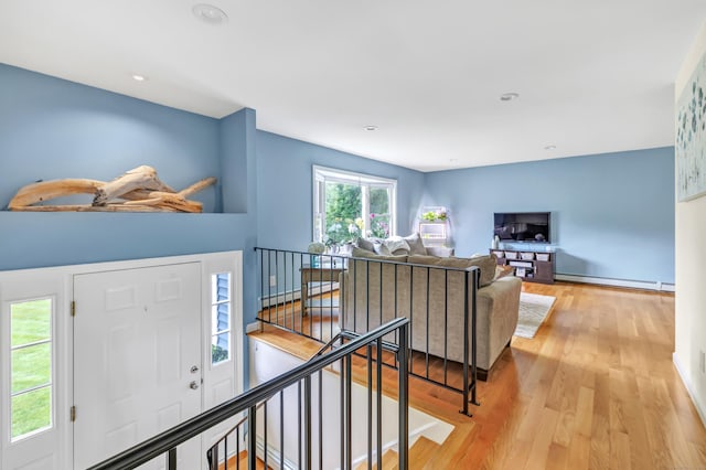175 Cross Hill Rd, Monroe, CT 06468 - foyer entrance featuring baseboard heating, wood finished floors, recessed lighting, and baseboards