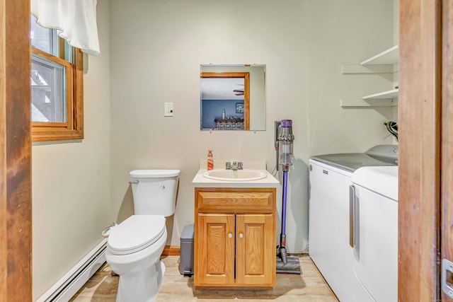 175 Cross Hill Rd, Monroe, CT 06468 - half bath with washer and dryer, toilet, a baseboard heating unit, and vanity