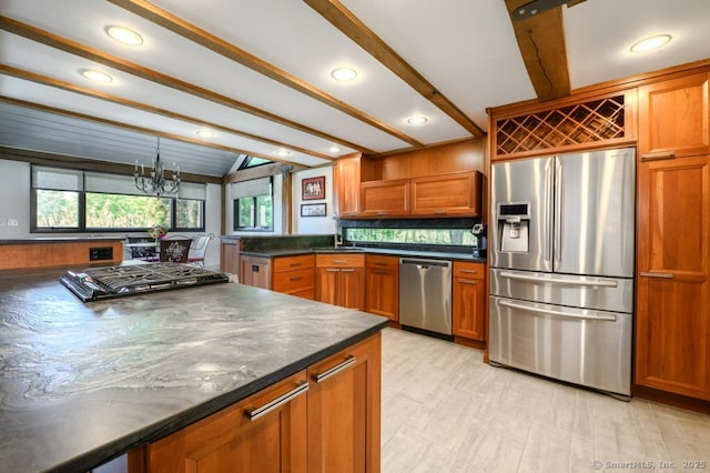 94 Boston Post Rd, Madison, CT 06443 - kitchen featuring appliances with stainless steel finishes, dark countertops, brown cabinetry, a chandelier, and recessed lighting