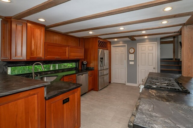 94 Boston Post Rd, Madison, CT 06443 - kitchen with appliances with stainless steel finishes, beamed ceiling, brown cabinets, a sink, and recessed lighting