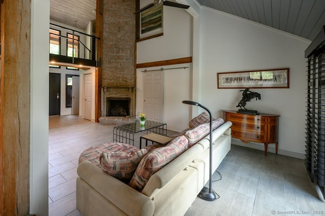 94 Boston Post Rd, Madison, CT 06443 - living area featuring wood ceiling, high vaulted ceiling, and a stone fireplace