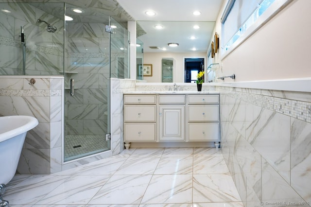 94 Boston Post Rd, Madison, CT 06443 - full bathroom featuring vanity, a soaking tub, a shower stall, marble finish flooring, and recessed lighting