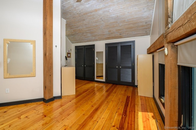 94 Boston Post Rd, Madison, CT 06443 - unfurnished living room with light wood finished floors, lofted ceiling, wooden ceiling, and baseboards