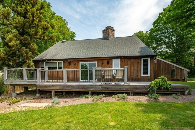 94 Boston Post Rd, Madison, CT 06443 - back of house featuring a chimney, a yard, roof with shingles, and a deck