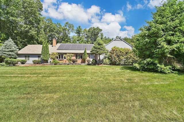 55 Windshire Dr, South Windsor, CT 06074 - ranch-style home featuring solar panels, a chimney, a front yard, and a shingled roof
