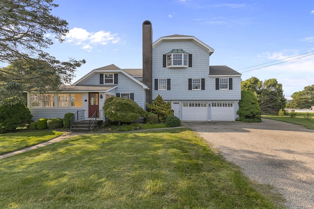 290 Neck Rd, Madison, CT 06443 - view of front facade with a chimney, asphalt driveway, an attached garage, and a front lawn