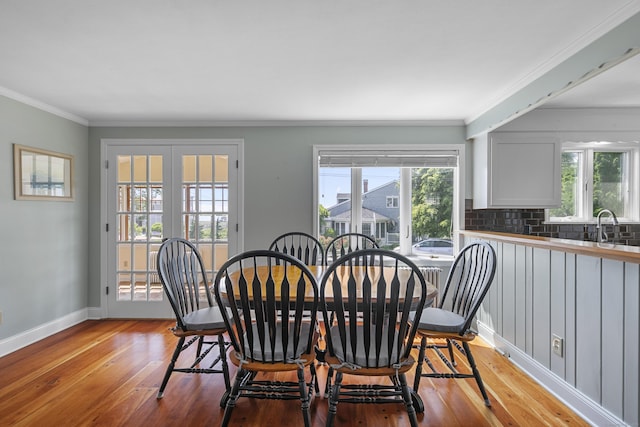 290 Neck Rd, Madison, CT 06443 - dining area featuring light wood-type flooring, baseboards, and crown molding