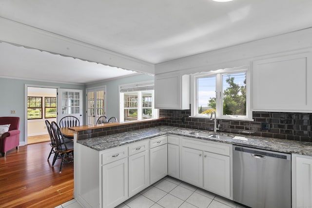 290 Neck Rd, Madison, CT 06443 - kitchen featuring stainless steel dishwasher, a sink, ornamental molding, tasteful backsplash, and a peninsula