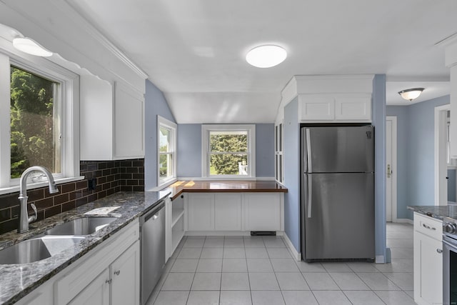 290 Neck Rd, Madison, CT 06443 - kitchen featuring appliances with stainless steel finishes, a sink, light tile patterned floors, backsplash, and white cabinets