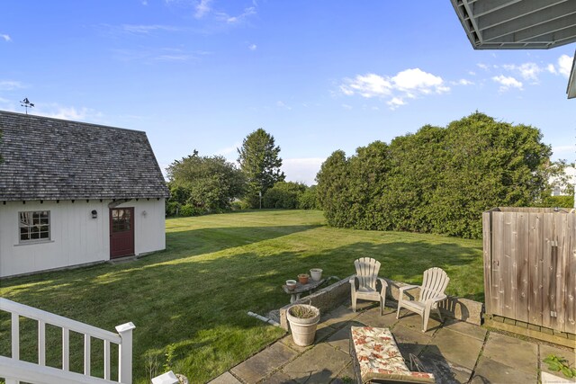 290 Neck Rd, Madison, CT 06443 - view of green lawn featuring a patio and an outbuilding