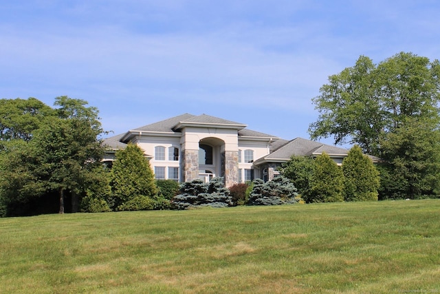 11 Pheasant Ridge Rd, Newtown, CT 06470 - view of front of home with stone siding, a front yard, and stucco siding