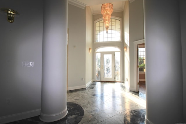 11 Pheasant Ridge Rd, Newtown, CT 06470 - foyer featuring ornamental molding, a chandelier, marble look tiles, and a towering ceiling