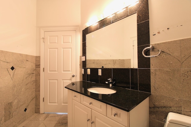 11 Pheasant Ridge Rd, Newtown, CT 06470 - bathroom featuring tile walls, vanity, and a wainscoted wall