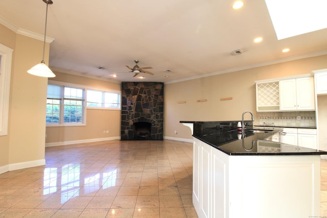 11 Pheasant Ridge Rd, Newtown, CT 06470 - kitchen with dark countertops, ceiling fan, ornamental molding, backsplash, and recessed lighting