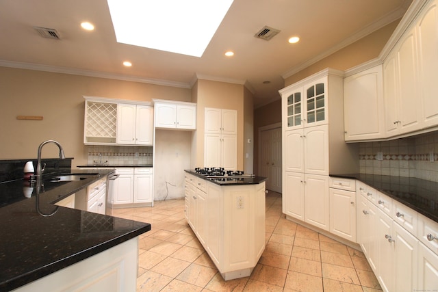 11 Pheasant Ridge Rd, Newtown, CT 06470 - kitchen with ornamental molding, a kitchen island, backsplash, gas cooktop, and recessed lighting