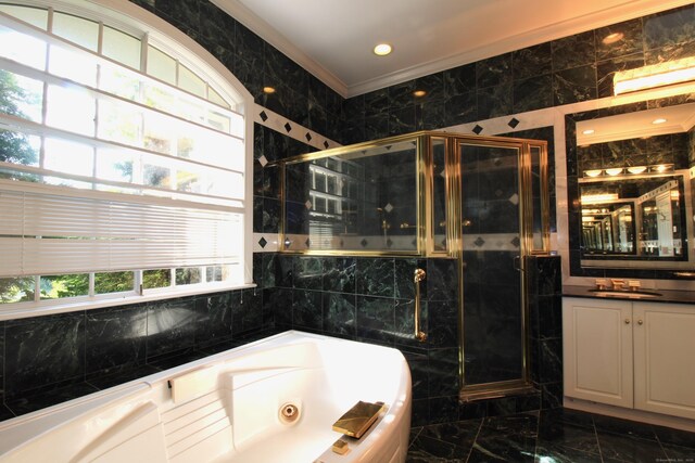 11 Pheasant Ridge Rd, Newtown, CT 06470 - full bath with tile walls, marble tiled flooring, a whirlpool tub, vanity, and a stall shower