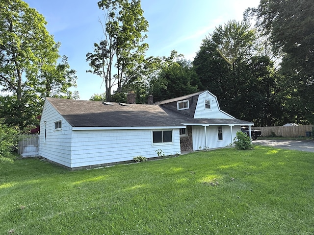 16-1/2 Maple St, Plainville, CT 06062 - view of front of house with a chimney and roof with shingles