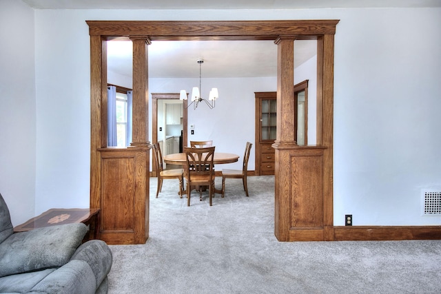 100 Union Ave, West Haven, CT 06516 - dining area with light colored carpet, a chandelier, and baseboards