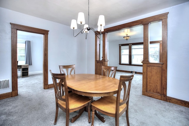 100 Union Ave, West Haven, CT 06516 - dining room featuring light carpet, a chandelier, and baseboards