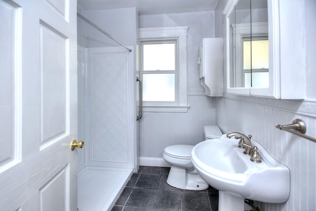 100 Union Ave, West Haven, CT 06516 - bathroom with a shower, toilet, tile patterned floors, and baseboards