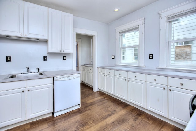 100 Union Ave, West Haven, CT 06516 - kitchen featuring white dishwasher, a sink, light countertops, white cabinets, and dark wood finished floors
