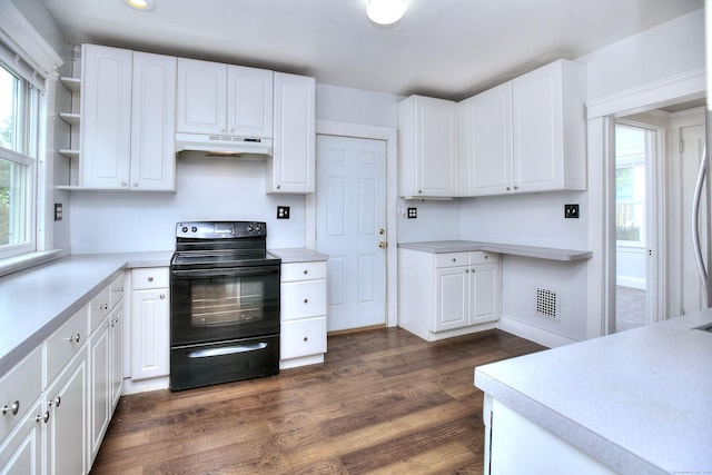100 Union Ave, West Haven, CT 06516 - kitchen featuring black electric range oven, under cabinet range hood, white cabinets, dark wood-style floors, and recessed lighting