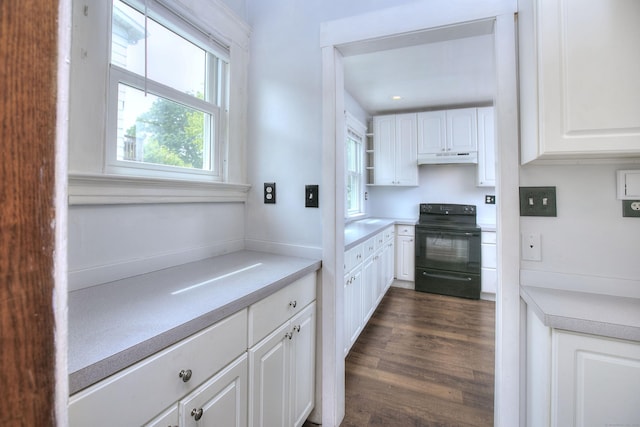 100 Union Ave, West Haven, CT 06516 - kitchen with black electric range oven, under cabinet range hood, white cabinetry, light countertops, and open shelves