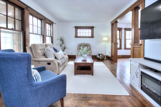 100 Union Ave, West Haven, CT 06516 - living area featuring dark wood-style floors, plenty of natural light, and baseboards