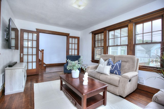 100 Union Ave, West Haven, CT 06516 - living area with plenty of natural light, wood finished floors, baseboards, and a textured ceiling