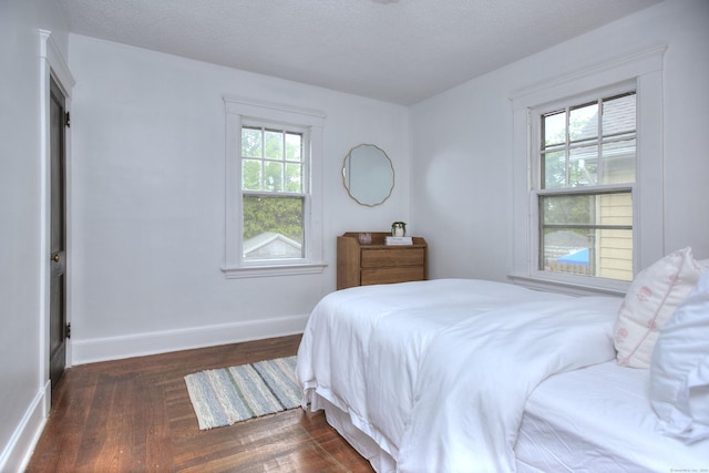 100 Union Ave, West Haven, CT 06516 - bedroom with dark wood-style floors, baseboards, and a textured ceiling