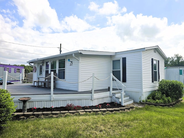 57 Cheyenne Rd, East Hartford, CT 06118 - view of side of home with a lawn