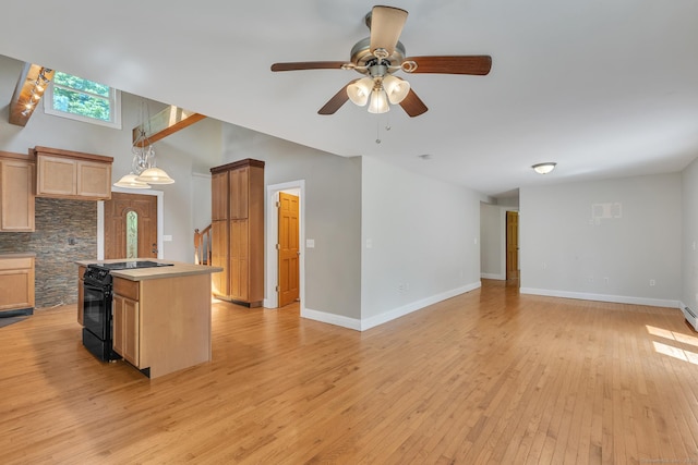 23 Ross Rd, Preston, CT 06365 - kitchen with black electric range oven, ceiling fan, open floor plan, light wood-style floors, and decorative light fixtures