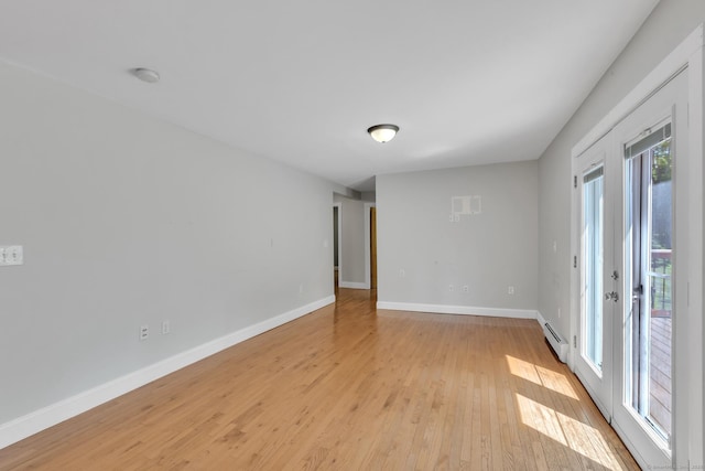 23 Ross Rd, Preston, CT 06365 - spare room with a baseboard heating unit, light wood-style flooring, and baseboards