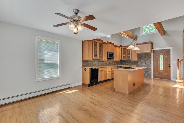 23 Ross Rd, Preston, CT 06365 - kitchen with wine cooler, baseboard heating, decorative backsplash, a center island, and light wood-type flooring