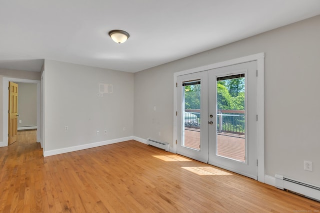 23 Ross Rd, Preston, CT 06365 - empty room featuring baseboard heating, a baseboard radiator, french doors, and light wood finished floors