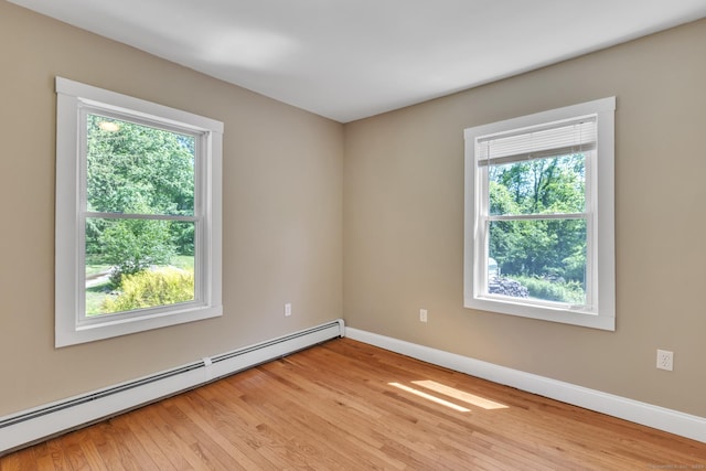 23 Ross Rd, Preston, CT 06365 - unfurnished room featuring a baseboard radiator, healthy amount of natural light, baseboards, and light wood-style flooring