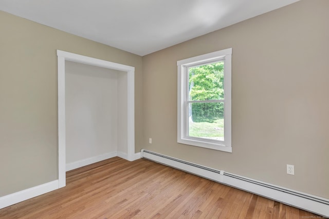 23 Ross Rd, Preston, CT 06365 - spare room featuring baseboard heating, light wood finished floors, and baseboards