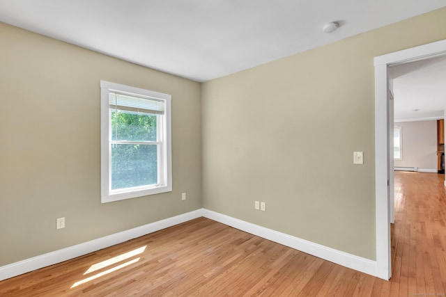 23 Ross Rd, Preston, CT 06365 - unfurnished room with baseboards, light wood-style floors, a smoke detector, and a baseboard heating unit