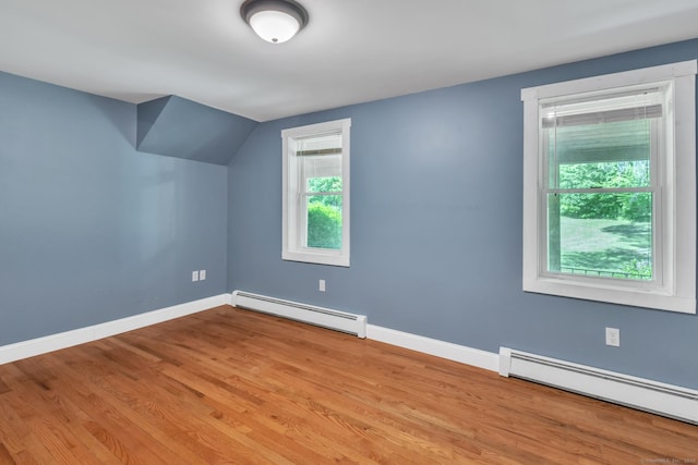 23 Ross Rd, Preston, CT 06365 - additional living space featuring a baseboard radiator, baseboards, wood finished floors, and lofted ceiling