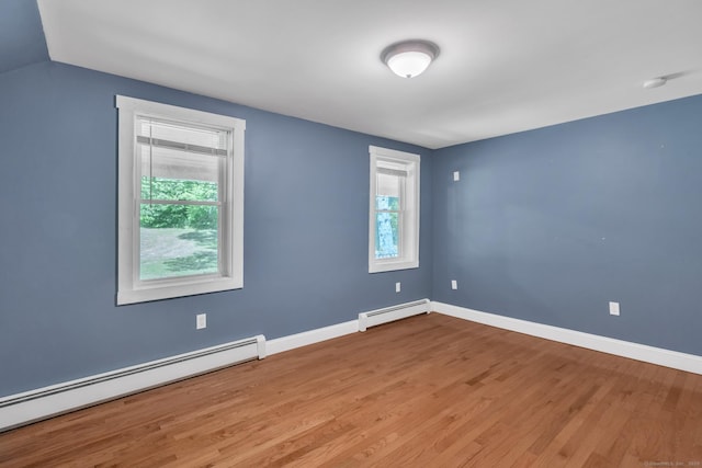 23 Ross Rd, Preston, CT 06365 - unfurnished room with a baseboard radiator, wood finished floors, baseboards, and a smoke detector