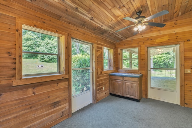 23 Ross Rd, Preston, CT 06365 - doorway to outside featuring vaulted ceiling, a ceiling fan, wooden walls, and light carpet