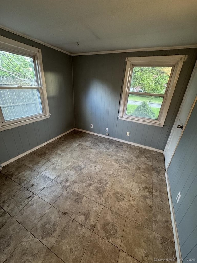 1 Stoughton Rd, Southington, CT 06489 - empty room featuring plenty of natural light, baseboards, wood walls, and ornamental molding
