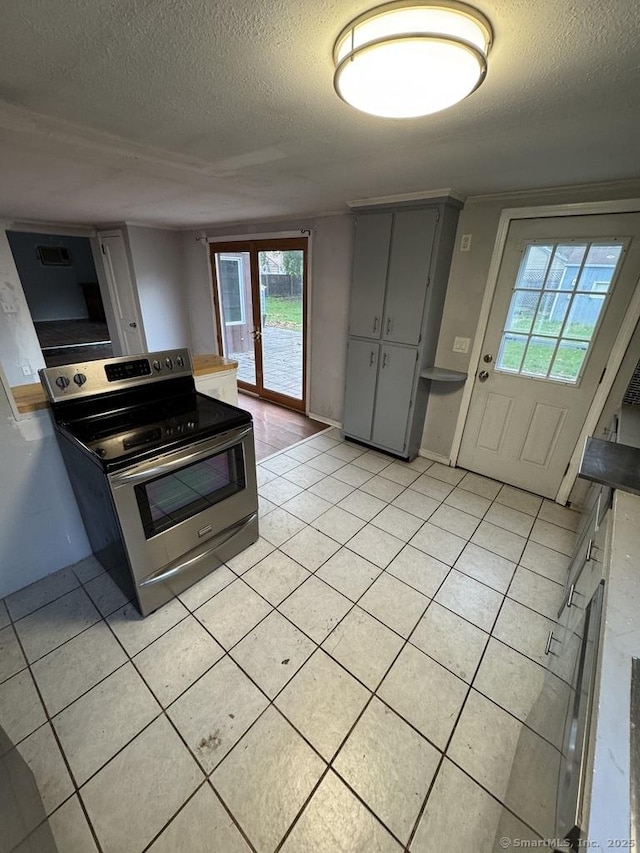 1 Stoughton Rd, Southington, CT 06489 - kitchen featuring stainless steel electric range oven, a textured ceiling, gray cabinetry, and light tile patterned floors