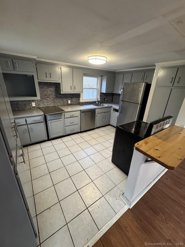 1 Stoughton Rd, Southington, CT 06489 - kitchen with gray cabinetry, stainless steel appliances, a sink, and decorative backsplash