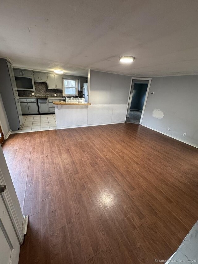 1 Stoughton Rd, Southington, CT 06489 - unfurnished living room with light wood-style floors