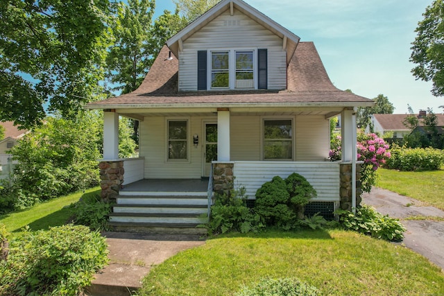 10 Wilson St, Plainville, CT 06062 - bungalow-style home with covered porch and a front lawn