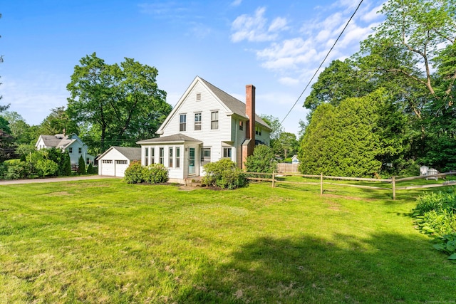 5 Maple Corners Rd, Ledyard, CT 06335 - back of house with a chimney, an outdoor structure, and a detached garage