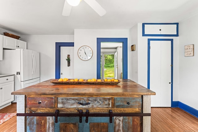 5 Maple Corners Rd, Ledyard, CT 06335 - detailed view of freestanding refrigerator, wood finished floors, a ceiling fan, and baseboards